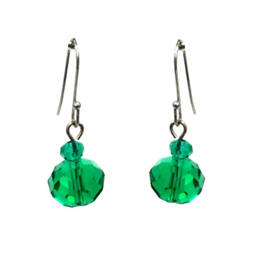 Close up of faceted emerald green crystals on a drop earring